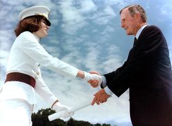 President George H. W. Bush hands a Cadet her diploma in 1991.
